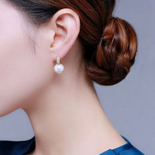 Load image into Gallery viewer, Lustrous Allure: 14mm Bright White Pearl Earring Adorned with Shimmering CZ Ear Hood