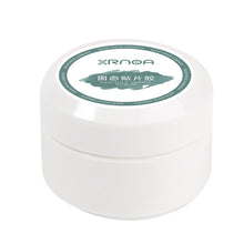 Load image into Gallery viewer, Solid Adhesive Nail Gel Wraps in a jar under UV lamp curing process.