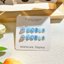 Load image into Gallery viewer, Pastel blue kids press-on nails with heart patterns and playful polka dots