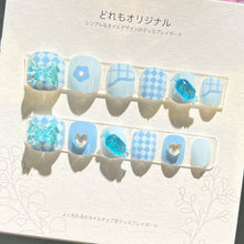 Load image into Gallery viewer, Aquatic blue kids press-on nails with starfish and seashell designs, glitter accents