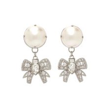 Load image into Gallery viewer, Platinum toned earrings with cute chic bows adorned with oversized resin pearls and white crystals