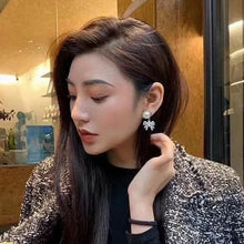 Load image into Gallery viewer, Platinum toned earrings with cute chic bows adorned with oversized resin pearls and white crystals