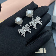Load image into Gallery viewer, MIU MIU Silver Micro Bow Earrings