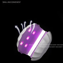 Load image into Gallery viewer, Stylish red Shell Mini UV Nail Lamp in use
