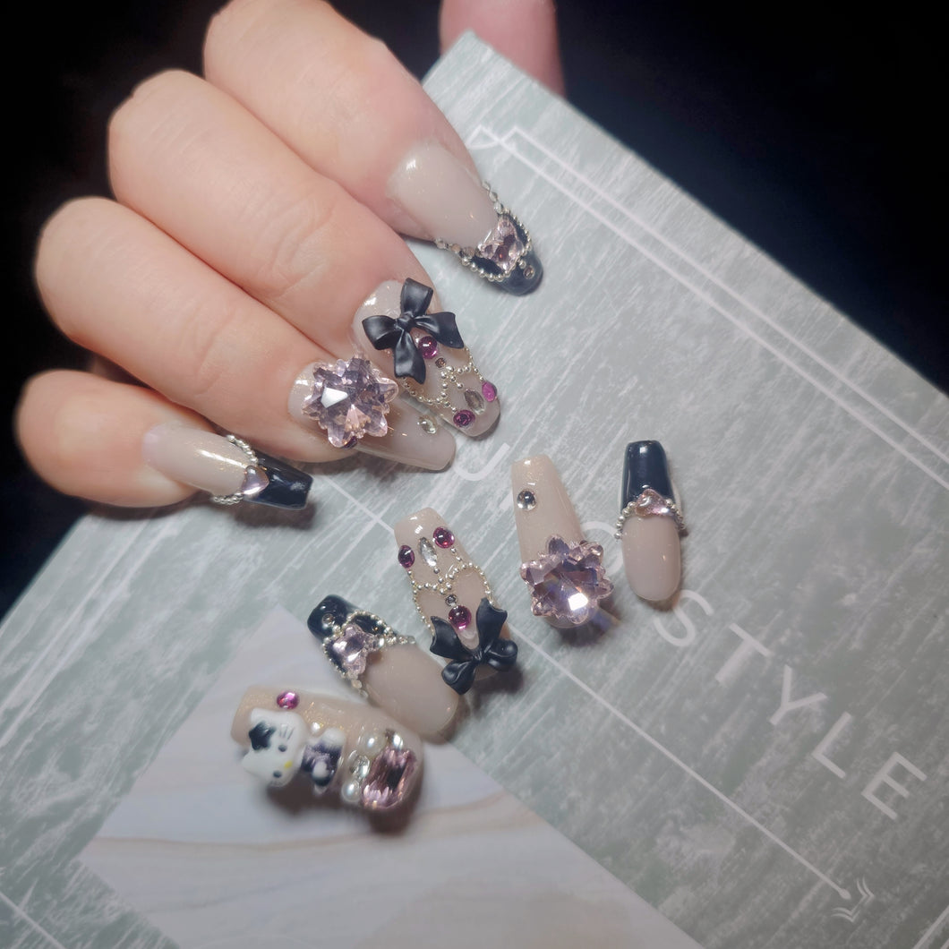 Chic Hello Kitty press-on nails with sparkling embellishments