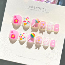 Load image into Gallery viewer, Cheerful pink kids press-on nails with fun expressions, candy patterns, and floral designs
